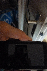 Cord behind handle of door